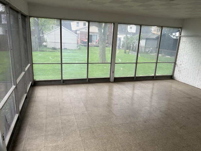 unfurnished sunroom with a wealth of natural light