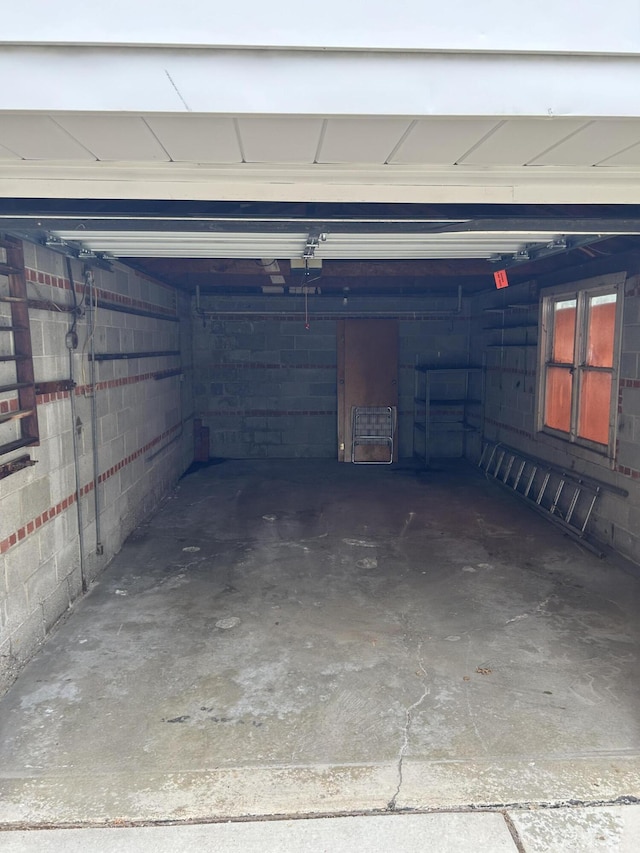 garage with concrete block wall