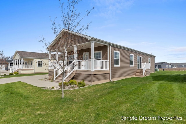 view of front of property with covered porch and a front lawn