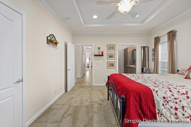 bedroom with crown molding, baseboards, light colored carpet, recessed lighting, and a tray ceiling