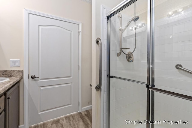 bathroom with vanity and a stall shower