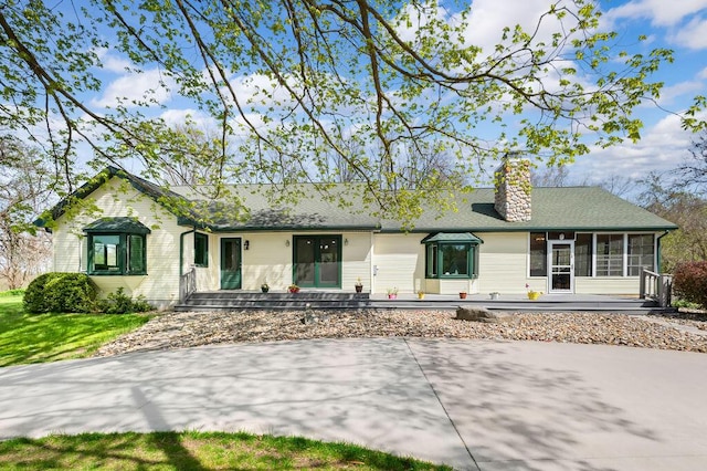 19117 Beaver Dam Rd, Galien, MI 49113 - ranch-style home featuring a chimney and a sunroom