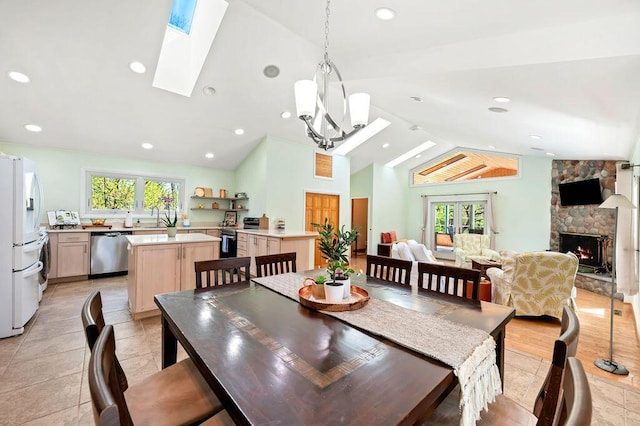 19117 Beaver Dam Rd, Galien, MI 49113 - dining room featuring plenty of natural light, recessed lighting, a stone fireplace, and a skylight