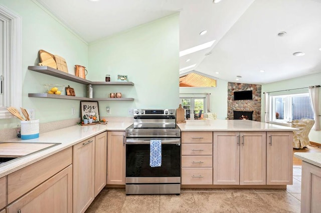 19117 Beaver Dam Rd, Galien, MI 49113 - kitchen featuring electric range, a wealth of natural light, a peninsula, and light brown cabinets
