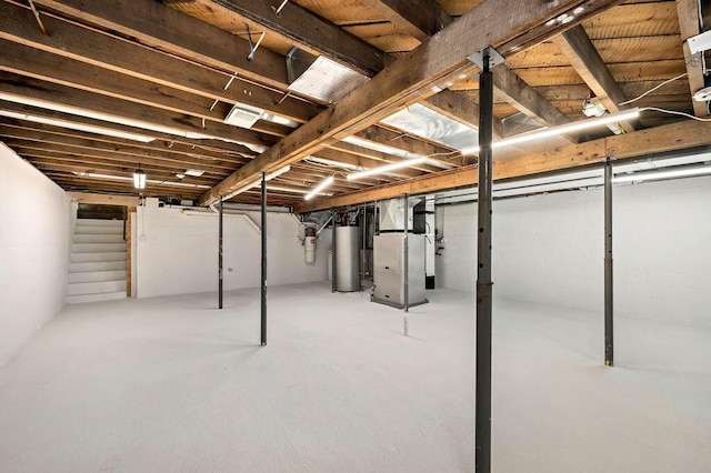 19117 Beaver Dam Rd, Galien, MI 49113 - unfinished basement with heating unit, gas water heater, and visible vents