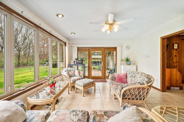 sunroom / solarium with french doors, ceiling fan, visible vents, and outdoor lounge area