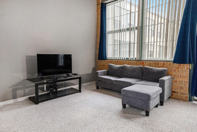 carpeted living room with baseboards