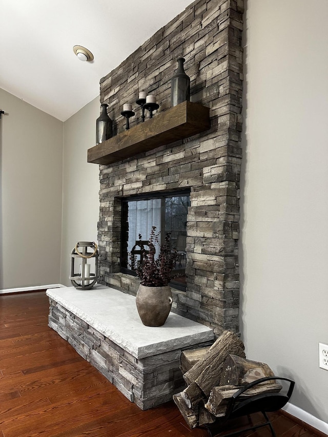 interior details with baseboards and wood finished floors