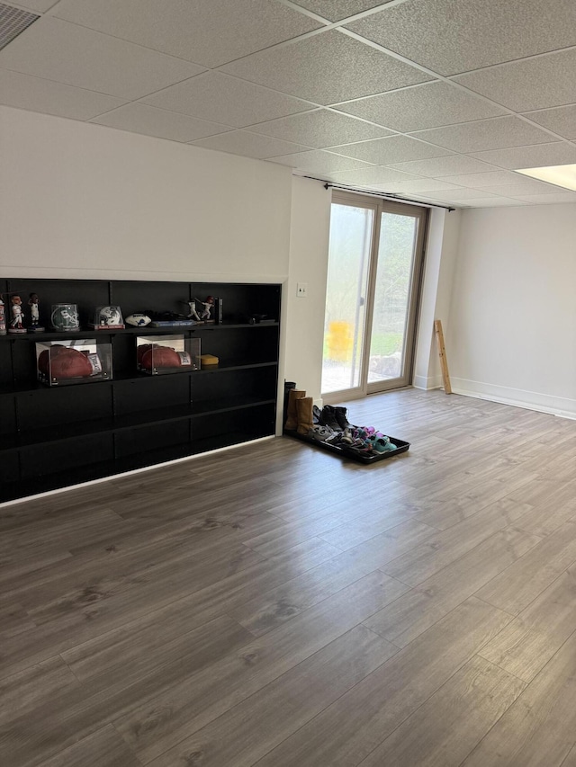 empty room featuring baseboards and wood finished floors
