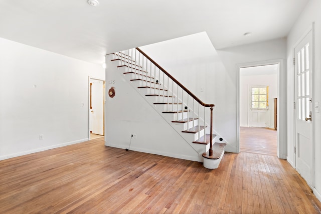 50505 Geddes Rd, Canton, MI 48188 - entryway featuring stairs, baseboards, and light wood-style flooring