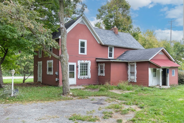 50505 Geddes Rd, Canton, MI 48188 - exterior space featuring a chimney and roof with shingles
