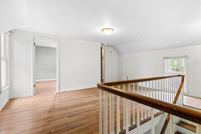 50505 Geddes Rd, Canton, MI 48188 - hallway with baseboards, an upstairs landing, lofted ceiling, and light wood-style floors