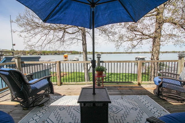 wooden deck featuring a water view