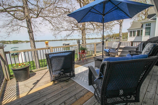 wooden terrace with a water view
