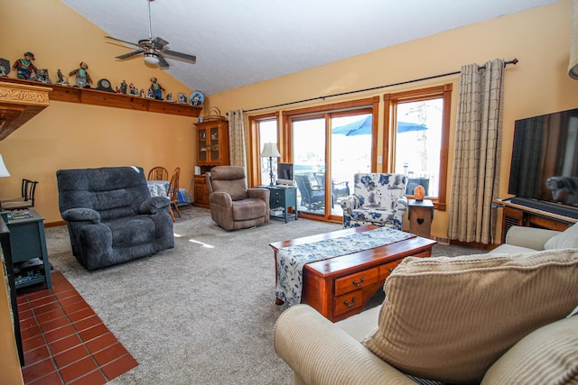 carpeted living room with a ceiling fan and lofted ceiling