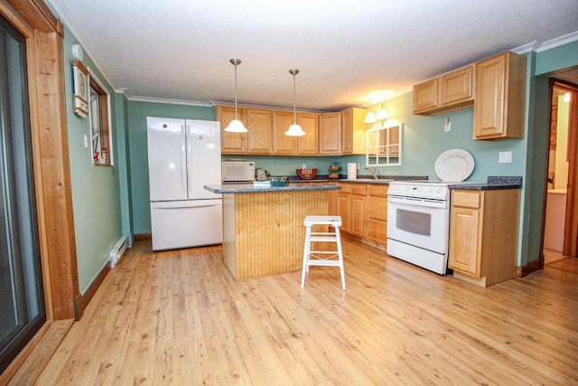 kitchen featuring a kitchen island, crown molding, dark countertops, white appliances, and light wood-style flooring