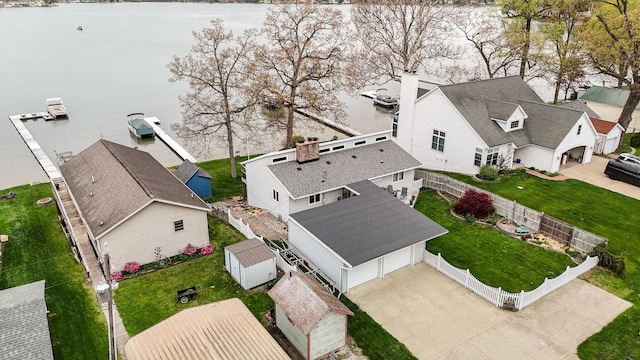 drone / aerial view featuring a residential view and a water view