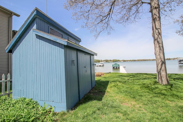 view of outbuilding with a water view