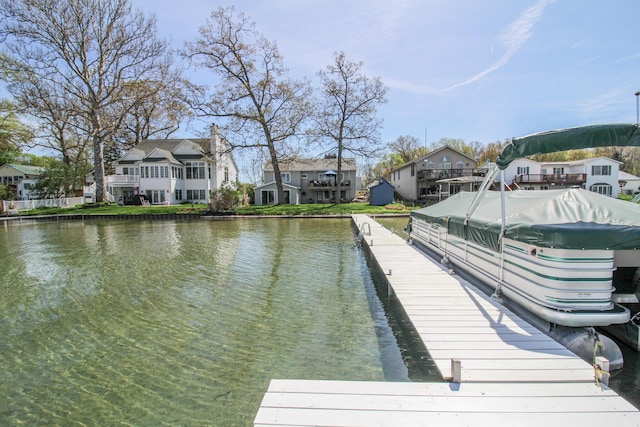 dock area with a water view and a residential view