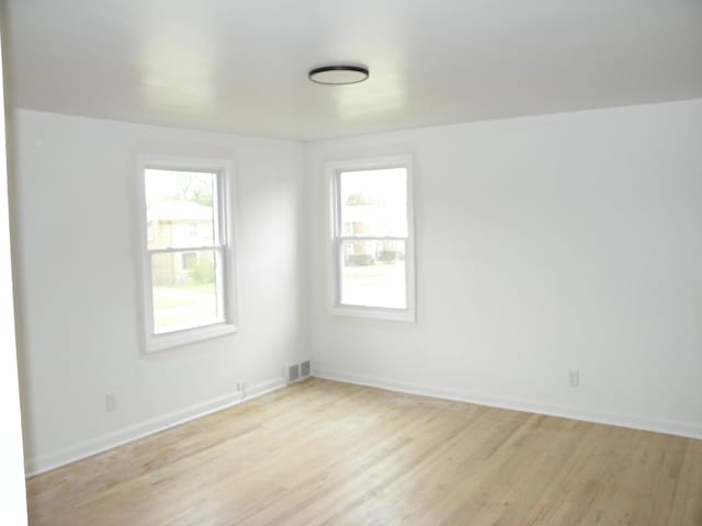 19209 Hartwell St, Detroit, MI 48235 - unfurnished room with healthy amount of natural light, light wood-type flooring, and baseboards