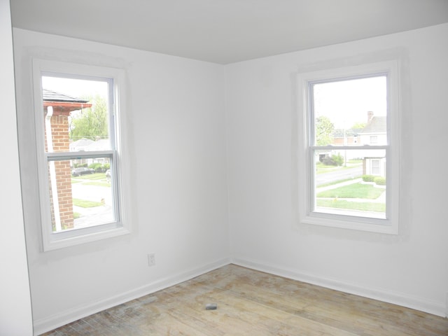 19209 Hartwell St, Detroit, MI 48235 - spare room with plenty of natural light, baseboards, and light wood-type flooring