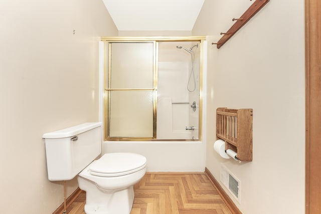 bathroom with baseboards, enclosed tub / shower combo, toilet, and visible vents