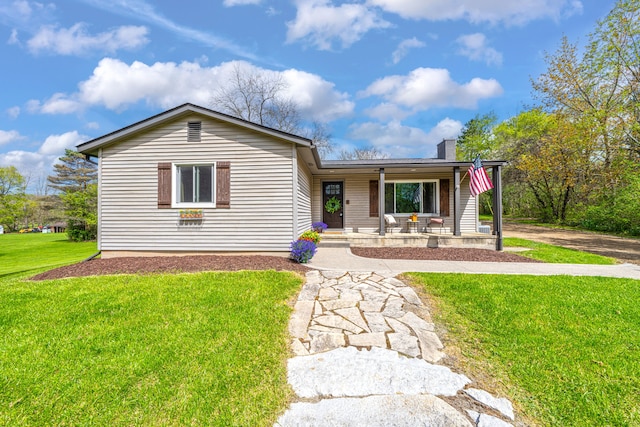 1205 Mckail Rd, Leonard, MI 48367 - ranch-style home with a porch, a front yard, and a chimney