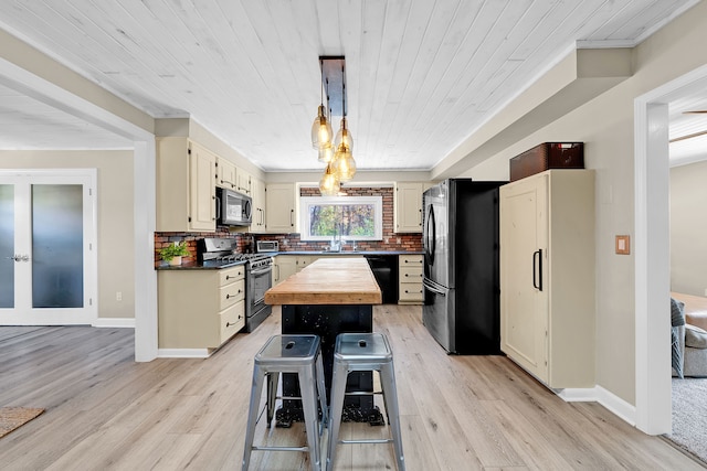 1205 Mckail Rd, Leonard, MI 48367 - kitchen featuring appliances with stainless steel finishes, light wood finished floors, a center island, decorative backsplash, and wood ceiling