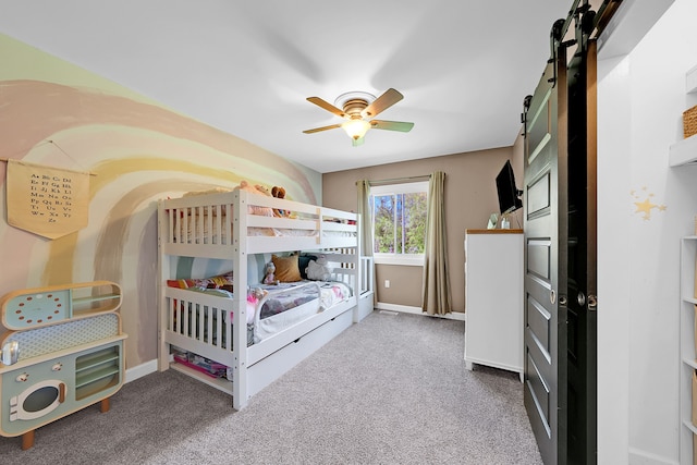1205 Mckail Rd, Leonard, MI 48367 - carpeted bedroom with a barn door, baseboards, and ceiling fan
