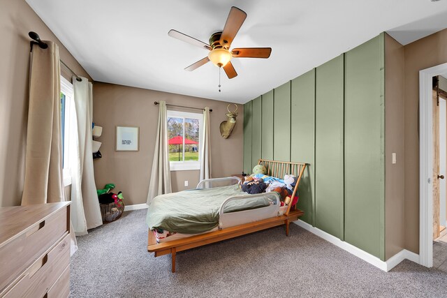 1205 Mckail Rd, Leonard, MI 48367 - bedroom with carpet floors, baseboards, and a ceiling fan