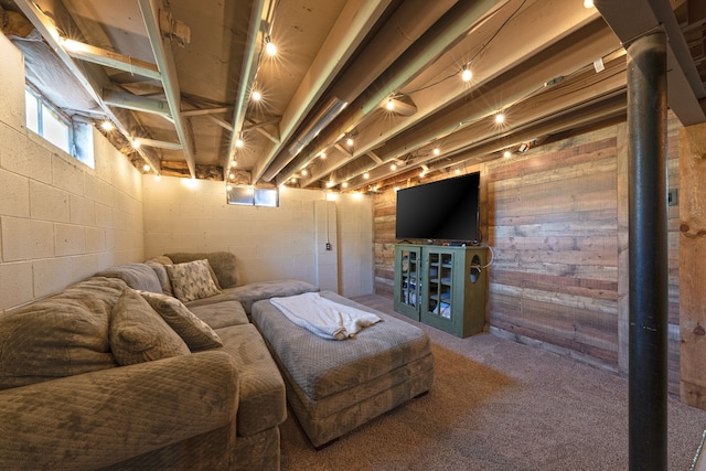 1205 Mckail Rd, Leonard, MI 48367 - living room with carpet flooring, wood walls, and concrete block wall