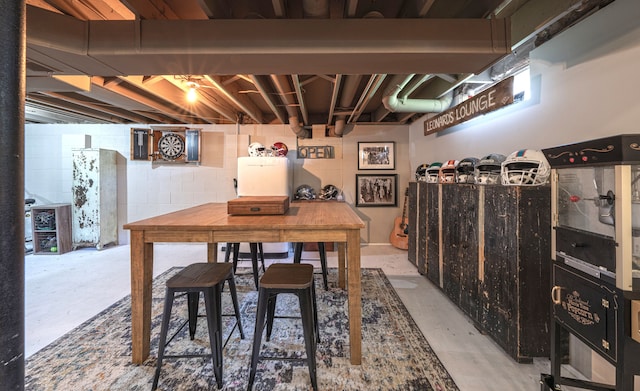 1205 Mckail Rd, Leonard, MI 48367 - dining area featuring concrete floors and concrete block wall