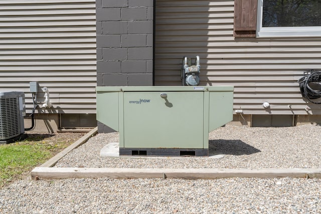 1205 Mckail Rd, Leonard, MI 48367 - exterior view of gas meter, central AC unit, and pet washing station
