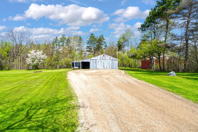 1205 Mckail Rd, Leonard, MI 48367 - detached garage featuring dirt driveway
