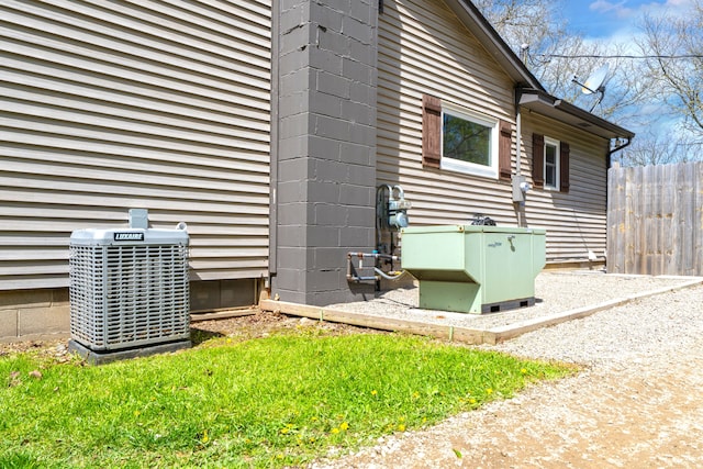 1205 Mckail Rd, Leonard, MI 48367 - view of side of property with central AC unit and fence