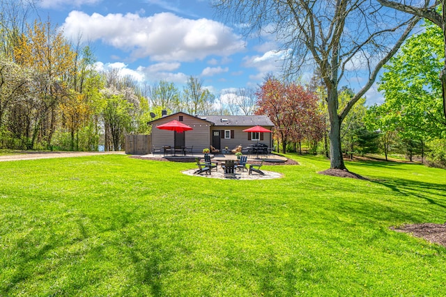 1205 Mckail Rd, Leonard, MI 48367 - view of grassy yard featuring a patio