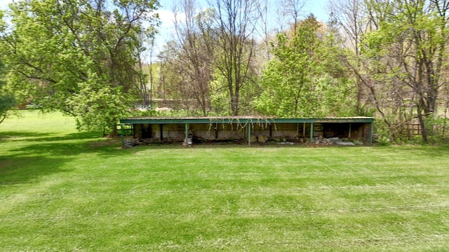 1205 Mckail Rd, Leonard, MI 48367 - view of green lawn featuring an outbuilding