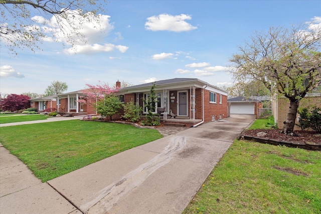 view of front of property featuring an outbuilding, brick siding, a detached garage, a front yard, and a porch