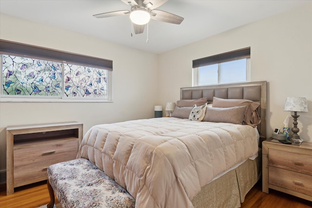 bedroom with wood finished floors and ceiling fan