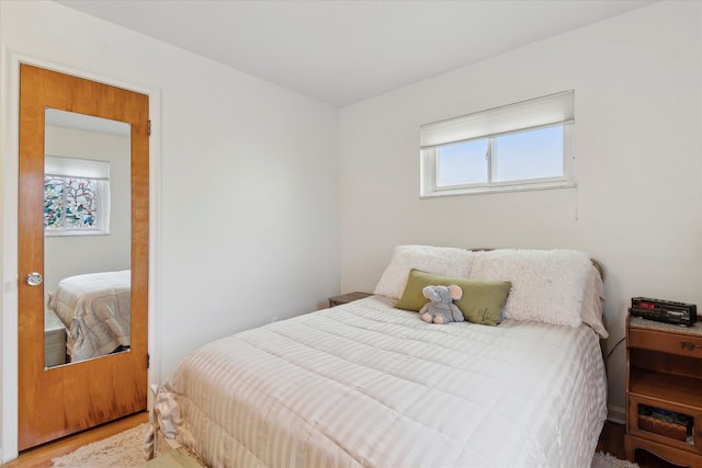 bedroom with wood finished floors