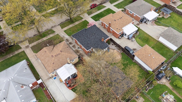 birds eye view of property with a residential view