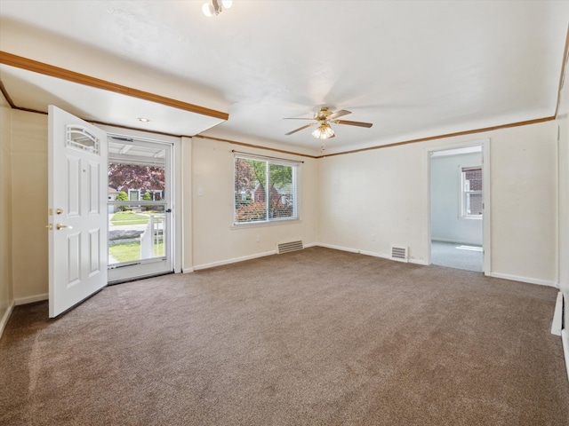 unfurnished room featuring carpet floors, ceiling fan, baseboards, and visible vents