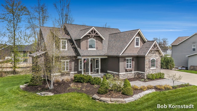 3779 Mesa Verde Dr, Hudsonville, MI 49426 - craftsman-style home with roof with shingles, driveway, a front lawn, and stone siding