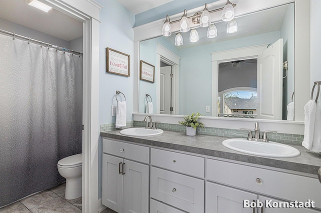 3779 Mesa Verde Dr, Hudsonville, MI 49426 - bathroom featuring double vanity, a sink, tile patterned floors, and toilet