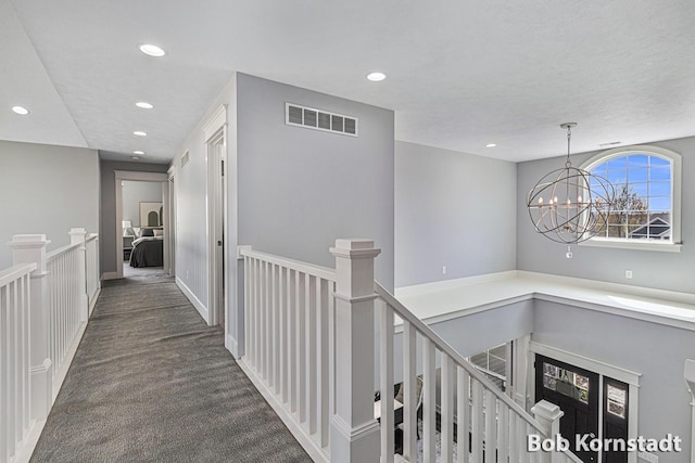 3779 Mesa Verde Dr, Hudsonville, MI 49426 - hall featuring recessed lighting, an upstairs landing, an inviting chandelier, and visible vents