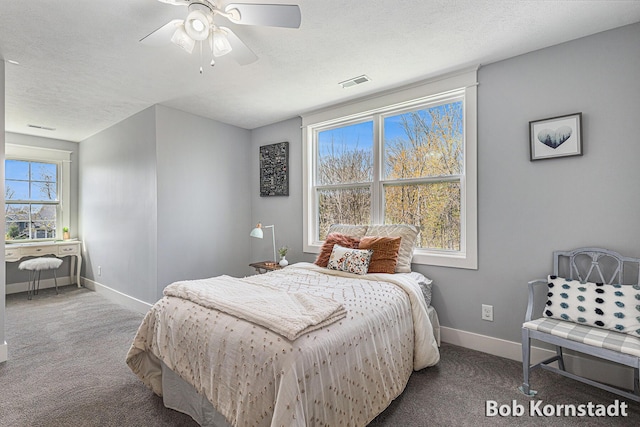 3779 Mesa Verde Dr, Hudsonville, MI 49426 - carpeted bedroom with baseboards, ceiling fan, and visible vents