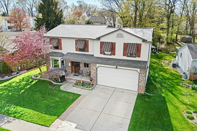 traditional home with a garage, driveway, roof with shingles, and a front yard