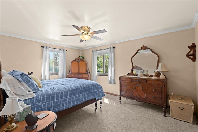 bedroom with carpet floors, ornamental molding, baseboards, and ceiling fan