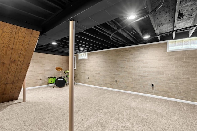below grade area with carpet floors and baseboards