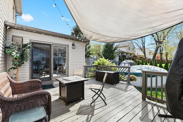 wooden terrace featuring a fenced backyard